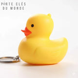 Porte clé canard lumineux LED vue de profil sur fond blanc, petit canard jaune en ABS avec anneau en acier inoxydable
