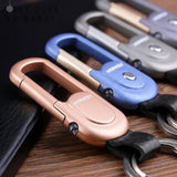 Porte clé femme design montrant les 4 différentes couleurs du porte clé : rose, bleu, gris et gris or