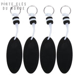 Lot de 4 porte-clés flottants noirs alignés sur fond blanc