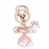 Porte clé licorne arc-en-ciel avec pendentifs licorne, fleur et nuages