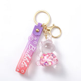 Porte-clé licorne bulle rose transparent avec dragon rose violet et décorations colorées