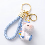 Porte-cle licorne Crochet, licorne blanche aux détails bleus avec lanière tressée bleu pastel et mousqueton doré