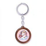 Porte clé licorne en bois rose avec motif tête de licorne et nuages