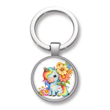 Porte-clé licorne fleur Bouquet solaire avec licorne bleue, crinière multicolore et grandes fleurs jaunes et orangées
