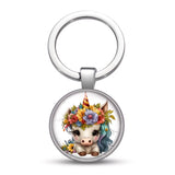 Porte clés licorne fleur Couronne florale avec petite licorne blanche coiffée d’un bouquet de fleurs multicolores