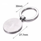 Dimensions du porte clé licorne fleur : anneau de 30 mm et médaillon rond de 27,7 mm de diamètre