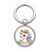 Porte-clefs licorne fleur Rose enchantée avec licorne blanche, crinière bleu pastel et couronne de roses