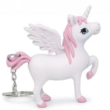Porte clé licorne lumineux blanc avec crinière rose et ailes sur fond blanc