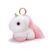 Porte clé licorne en peluche blanche et rose avec corne dorée, queue duveteuse et anneau métallique doré