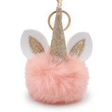 Porte-clé licorne pompon rose saumon avec corne dorée pailletée