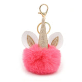 Porte-clé licorne pompon rose vif avec corne dorée et oreilles blanches