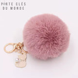 porte-clé pompon fourrure très douce rose pale et breloque et chat doré