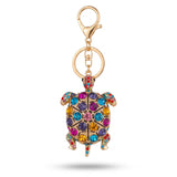 Porte clé tortue à motif doré avec pierres multicolores sur fond blanc