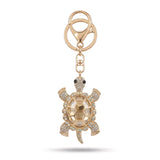 Porte clé tortue gros diamant champagne avec cristaux clairs et finition dorée