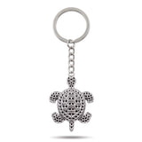 Porte clé tortue métal argenté avec carapace détaillée sur fond blanc