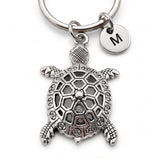 Porte clé tortue personnalisé avec pendentif tortue argenté et initiale gravée