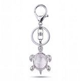 Porte clé tortue avec pierre cristal transparente et monture argentée