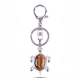 Porte clé tortue pierre œil de tigre marron avec reflets dorés