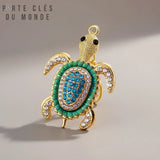 porte clé tortue strass bleu turquoise et  couleur doré