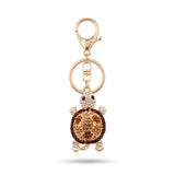 Porte clé tortue zircon marron et doré à strass sur fond blanc