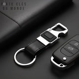 Porte clef décapsuleur lampe sur fond noir élégant, design chic et multifonction