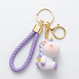 Porte-clef licorne Crochet violet sur fond blanc, avec lanière tressée, anneau et mousqueton dorés