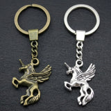 Deux porte-clefs licorne ailée aux finitions bronze et argentée