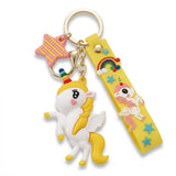 Porte-clés licorne, licorne ailée blanche à crinière jaune avec corne multicolore et lanière décorée d'un arc-en-ciel, d'une licorne et des petites etoiles bleu