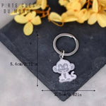porte clés pour couple singe avec dimensions affichées