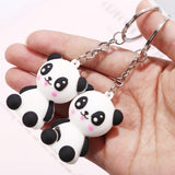 Porte clé panda heureux